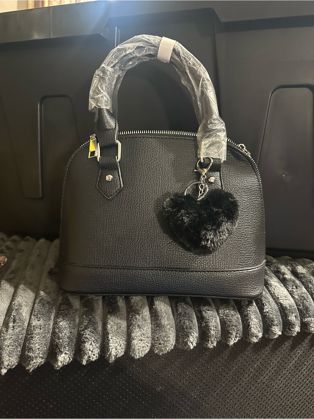 Structured Black Dome Crossbody Satchel with Heart Pom Keychain